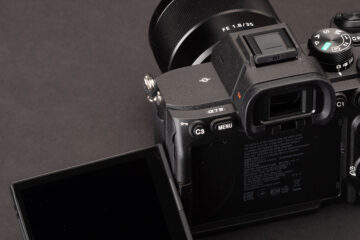 Camera with screen resting on desk